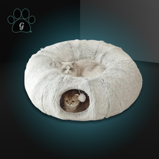 A gray semi-enclosed donut shaped plush cat bed and two cats