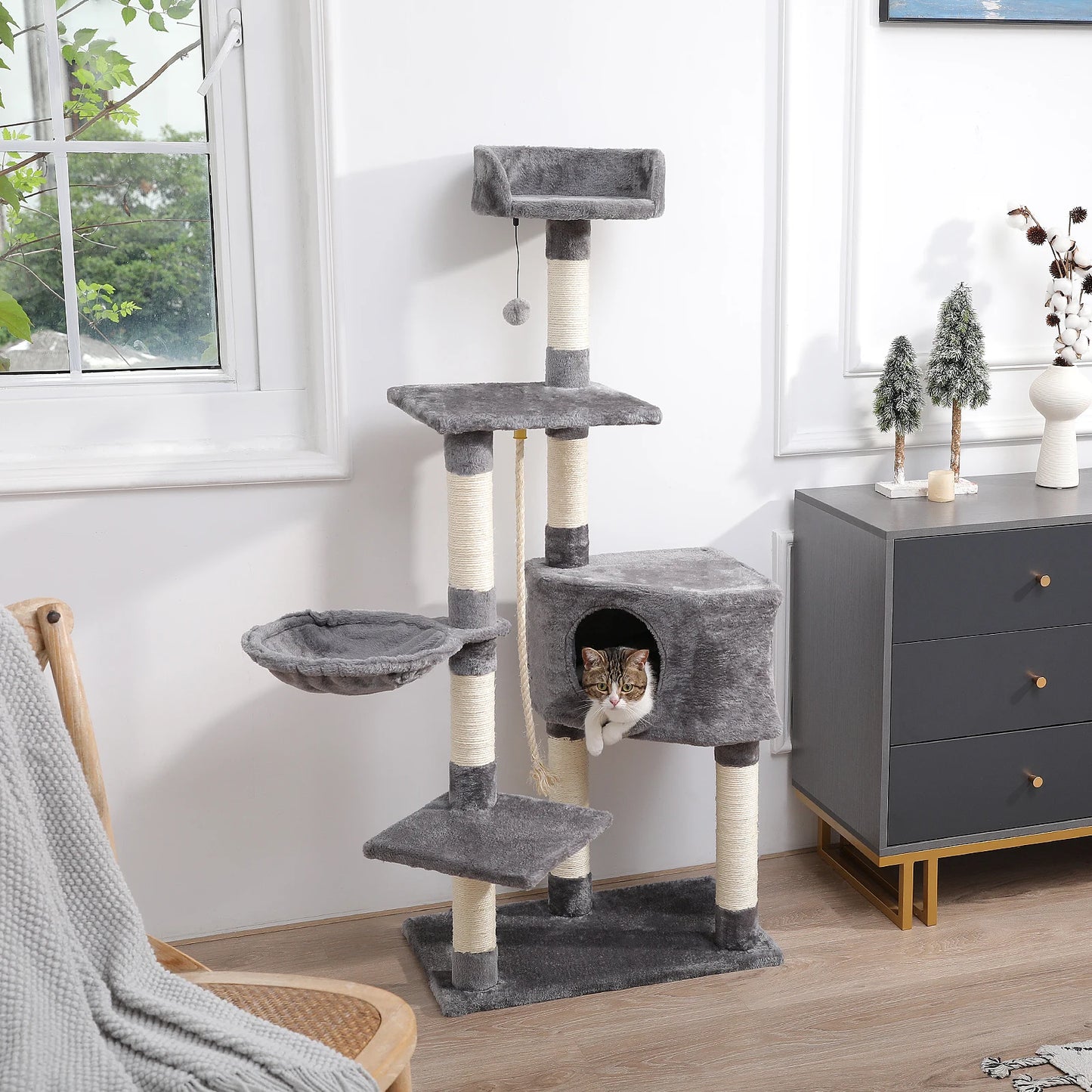 dark gray cat tree tower with cat  in condo