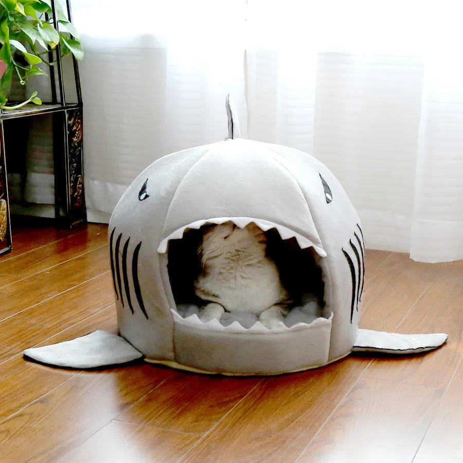 Gray enclosed cat bed with cat inside