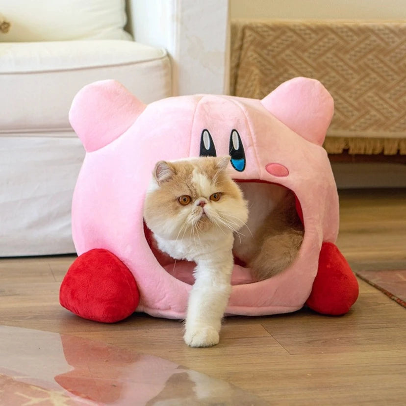 semi enclosed Kirby cat bed with cat exiting