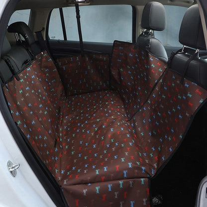 Back seat automotive pet cover in brown with dog prints.