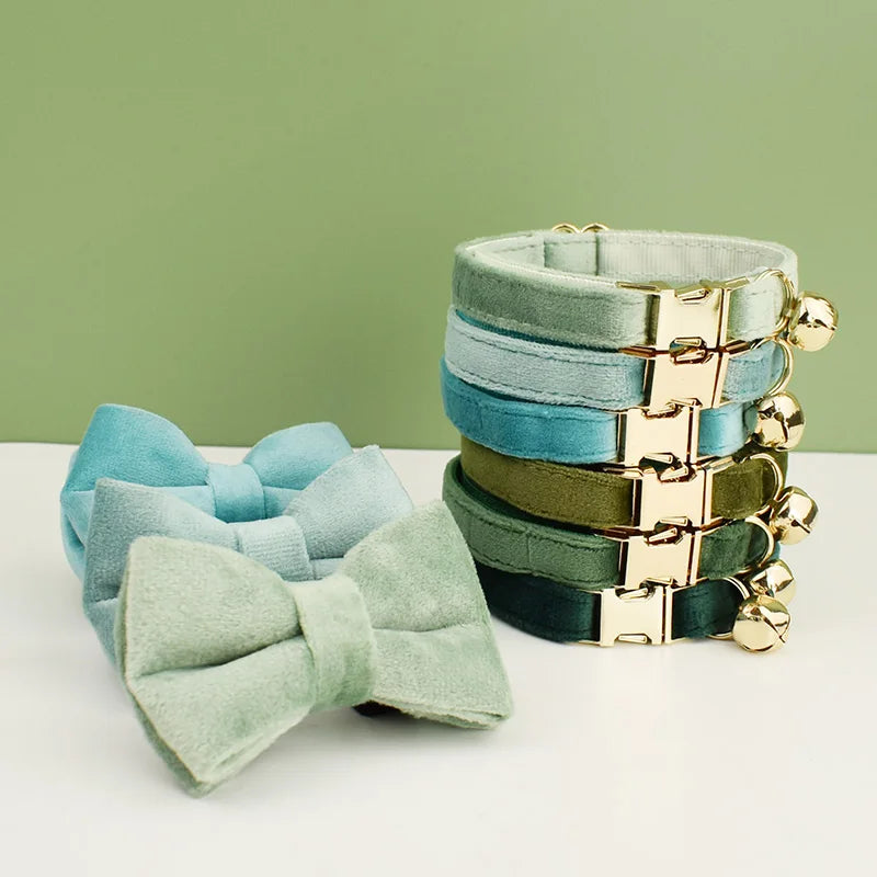 stack of cat collars in various colors with matching bowties