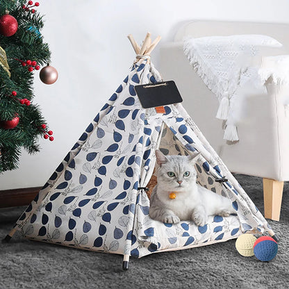 white pet tipi tent with blue leaves shown in living room