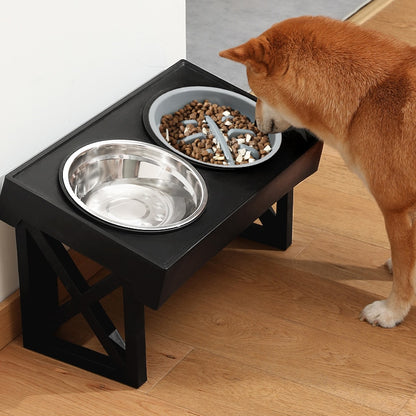 dog eating from elevated and angled pet feeding set with stainless steel bowl and slow feeder bowl