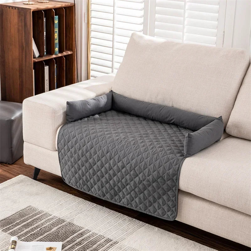 gray partial patterned couch cover with bolsters