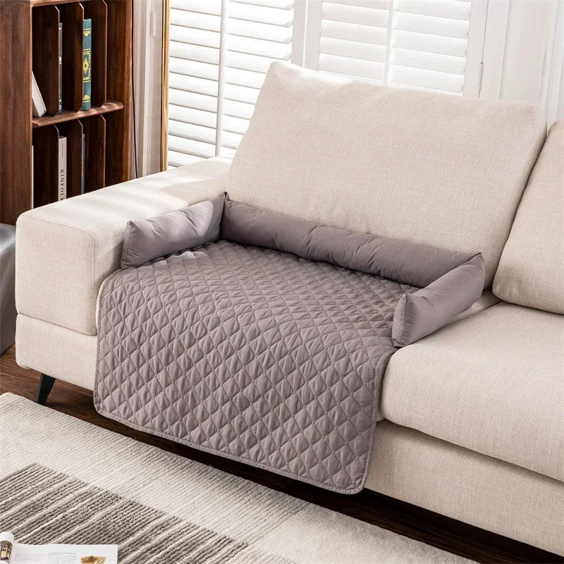 gray partial patterned couch cover with bolsters