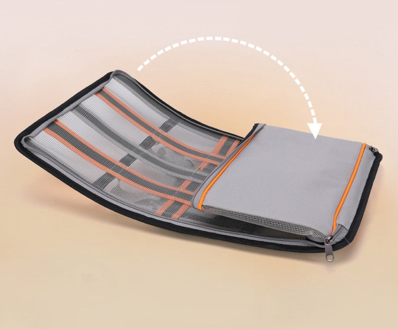 Gray and orange bag shown in fully collapsed and foldable form.