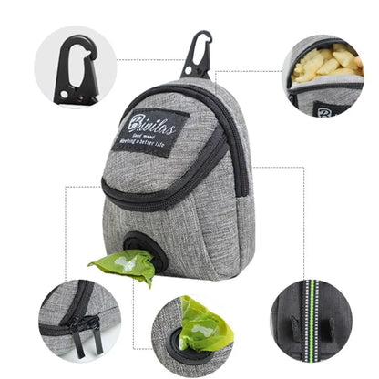 Feature show including carabiner style clip, treat compartment, velcro attachment, and bag dispener.