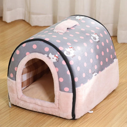 Gray enclosed cat bed with pink polka dots