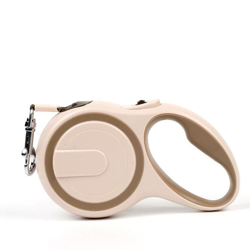 Beige and tan retractable leash 