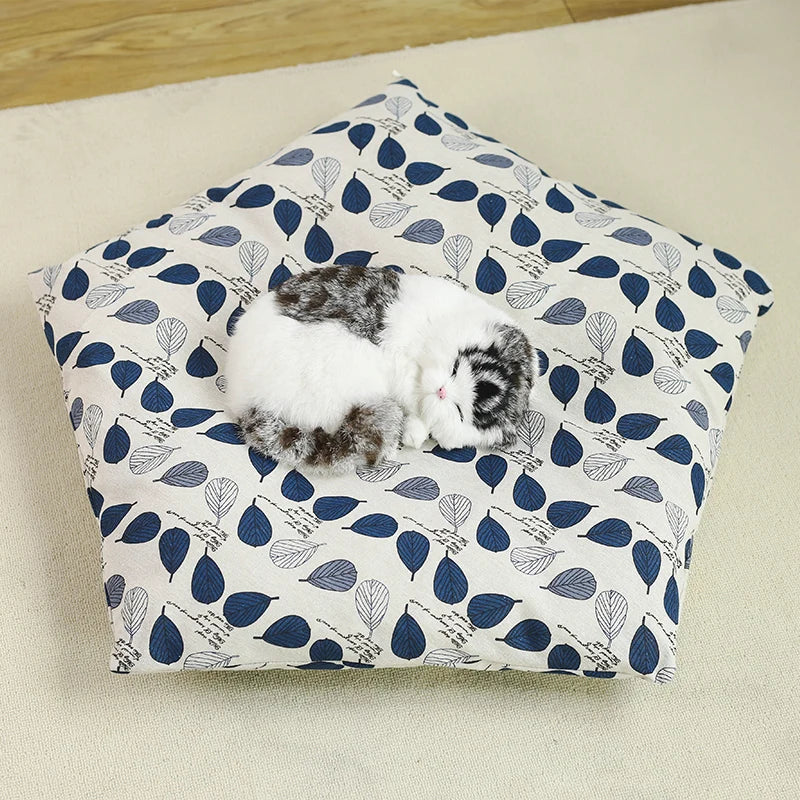 removable pillow for white pet tipi tent with blue leaves shown with cat on top