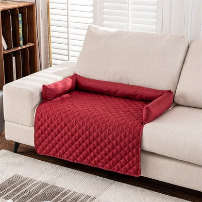 red partial patterned couch cover with bolsters