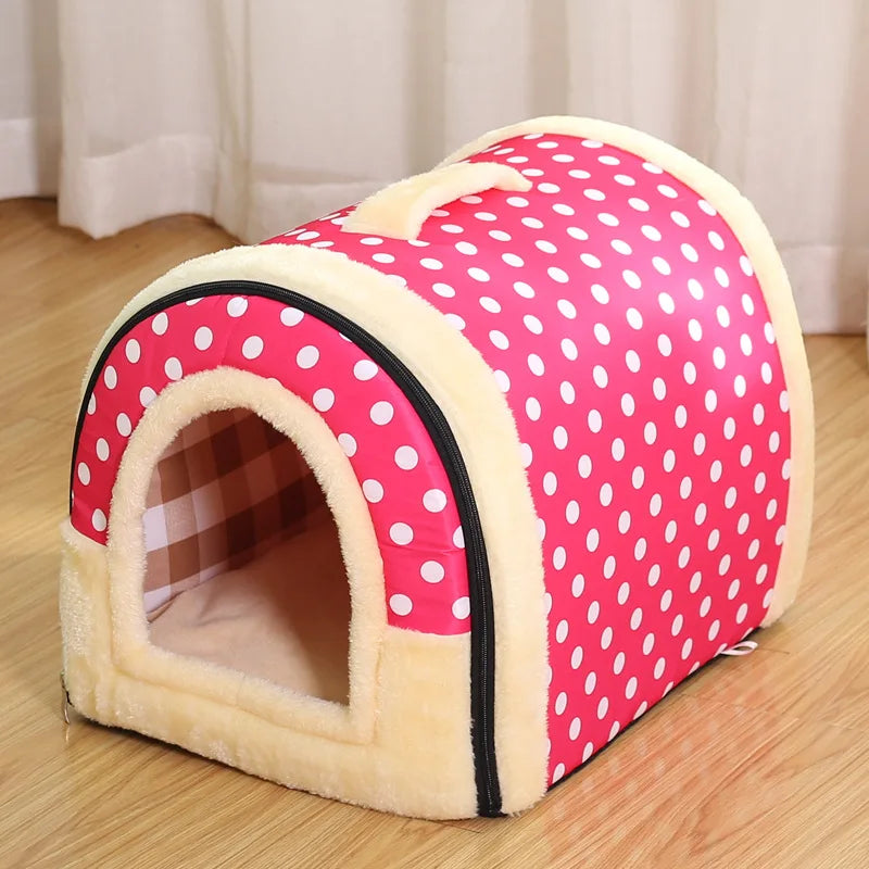 Pink enclosed cat bed with white polka dots