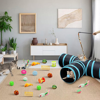 black and blue cat tunnel toy in living room surrounded by assorted cat toys