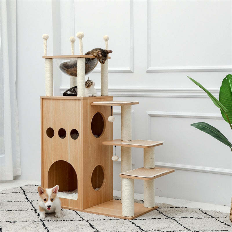 natural wood multilevel cat condo tower with sleeping basket shown in room