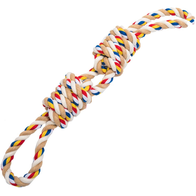 Tan, white, blue, yellow, and red colored rope toy